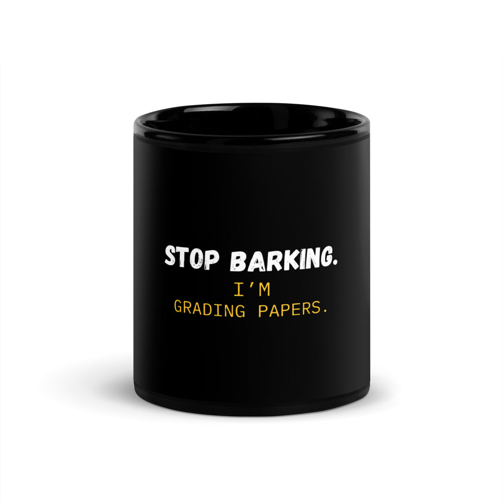 Black ceramic mug with Stop Barking I'm Grading Papers text in white letters