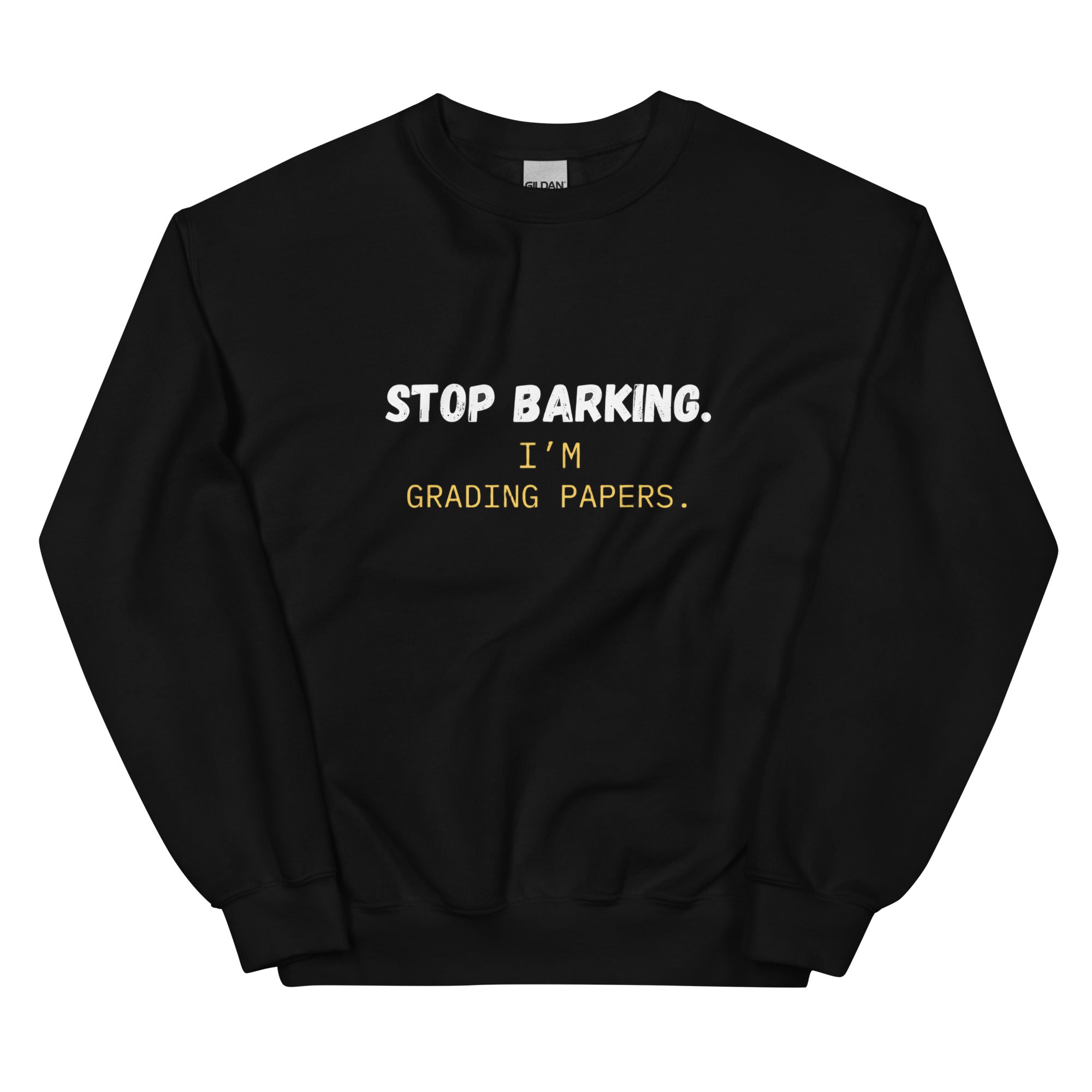 Close-up of white Stop Barking I'm Grading Papers text on navy sweatshirt chest